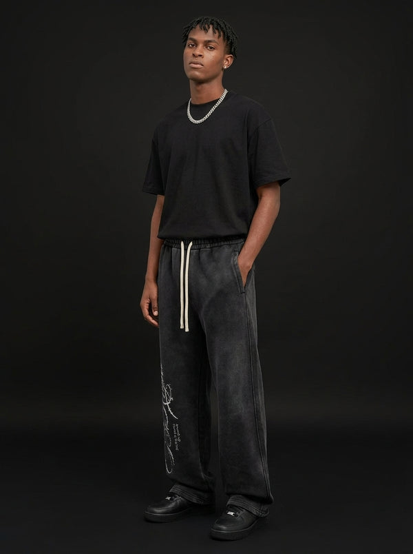 Rhinestone Script Sweatpants in Washed Black, worn, three-quarter view