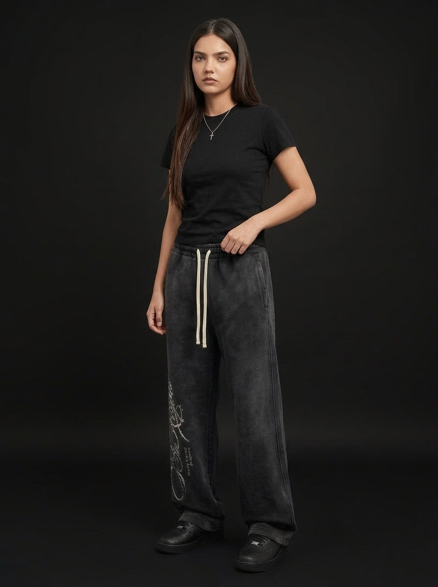 Rhinestone Script Sweatpants in Washed Black, worn by a woman, three-quarter view