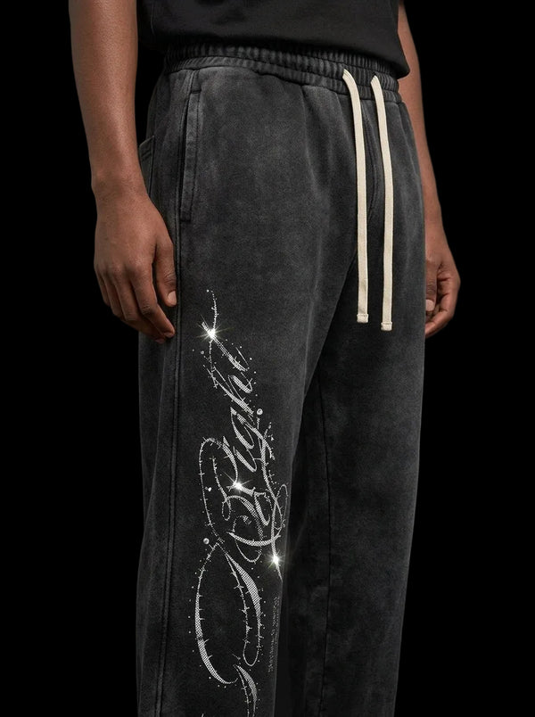 Close-up of the Be Right script print and rhinestones on the left leg