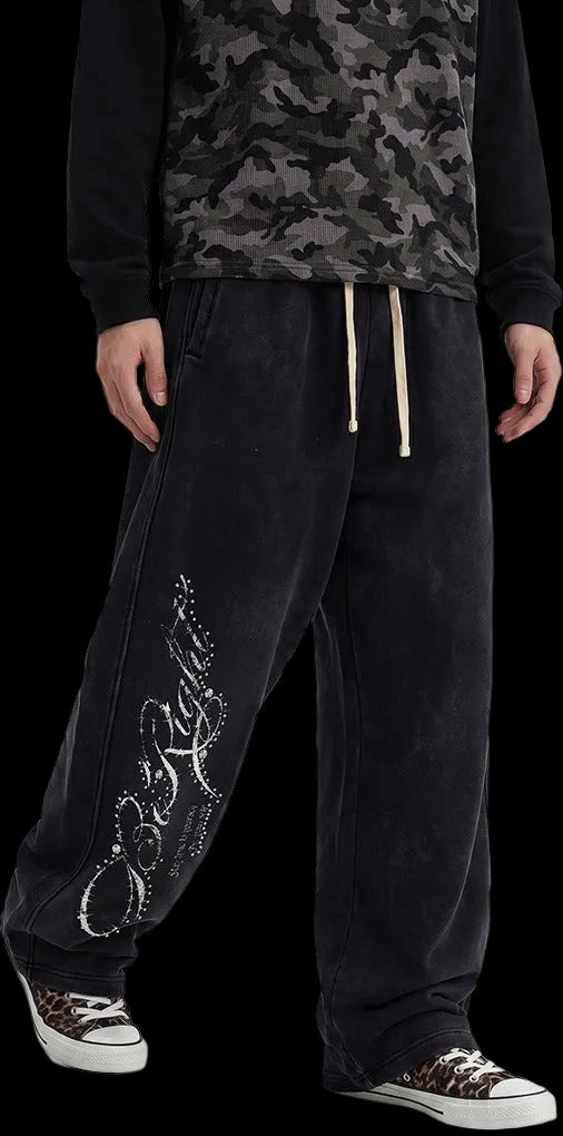 Rhinestone Script Sweatpants in Washed Black, worn, three-quarter view